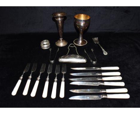 A COLLECTION OF SILVER AND EPNS To include silver bladed knives and forks, a silver weighted candle stick, silver bladed and 