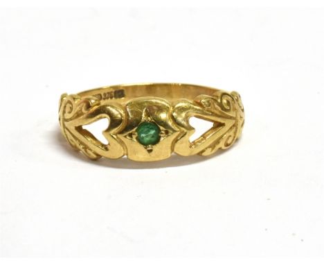 A 9C GOLD EMERALD SET DRESS RING  the ring set with a tiny emerald with openwork heart detail, ring size K ¾ weight 2grams