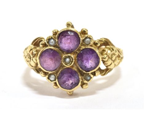 A 9CT GOLD, PURPLE ALMANDINE AND SEED PEARL CLUSTER RING  the ring set with four faceted round cut almandines each measuring 