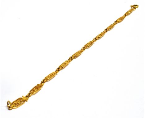 A STAMPED 750 YELLOW METAL EGYPTIAN PANEL BRACELET  the bracelet fitted with ten openwork panels depicting Egyptian symbols a