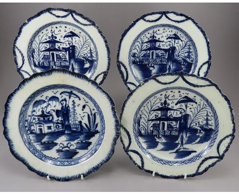 A group of four late eighteenth century pearlware plates, c.1790-1800. Each has a moulded shell edge a leaf rim with a hand-p