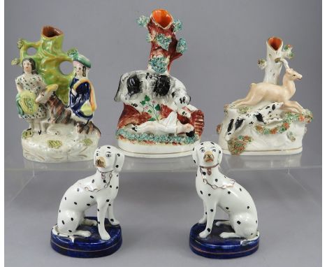 A group of late nineteenth century Staffordshire spill vases groups, c. 1860-1870 together with a pair of 1920s dogs. They ar