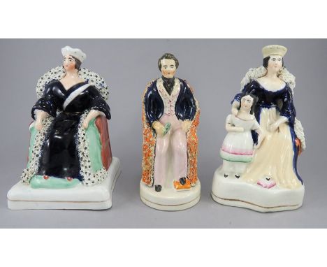 A group of mid-nineteenth century Staffordshire figures, c. 1840-45.The first depicts Queen Victoria on the throne, one of Qu