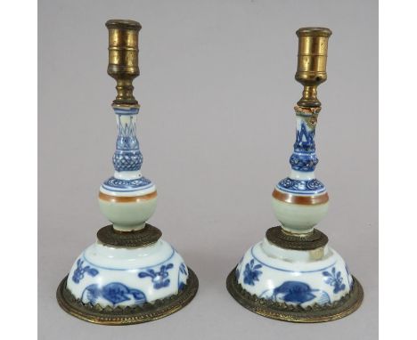 A pair of Chinese hand-painted porcelain taper assembled from various ceramic components (18th C), assembled c. 1900. Both pa