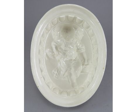 A fine late eighteenth century creamware jelly mould, c. 1790. It depicts a girl playing with a puppy. 19 cm wide. (1)Conditi