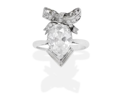 DIAMOND RING,  EARLY 20TH CENTURYThe pear-shaped diamond weighing 2.32 carats, between the single-cut diamond bow and baguett