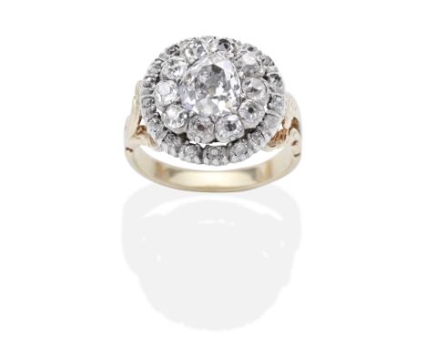 DIAMOND CLUSTER RING, 19TH CENTURYThe pear-shaped diamond within a cushion-shaped and rose-cut diamond double surround, conve
