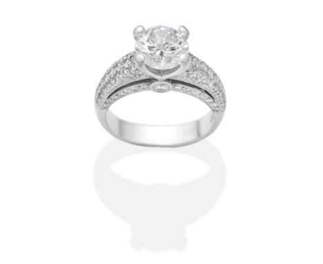 DIAMOND SINGLE-STONE RINGBrilliant-cut diamond weighing 1.95 carats between similarly-cut diamond shoulders and gallery, ring