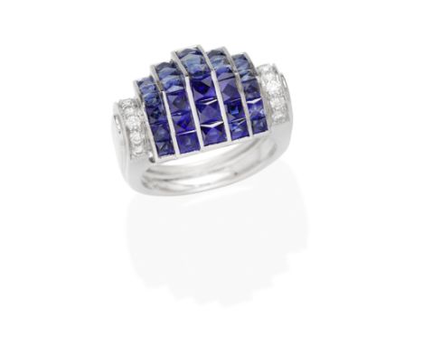 SAPPHIRE AND DIAMOND DRESS RINGOf stepped design, the rows of French-cut sapphires, between rounded brilliant-cut diamond sho