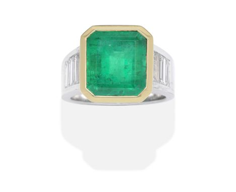 EMERALD AND DIAMOND RINGBicoloured, the step-cut emerald between baguette-cut diamond shoulders, diamonds 1.80cts total, emer