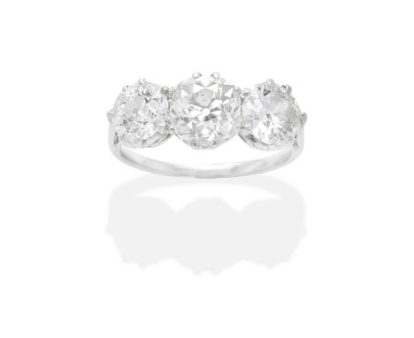 DIAMOND THREE-STONE RINGThe cushion-shaped diamond, between old brilliant-cut diamonds,  diamonds approx. 3.10cts total, ring