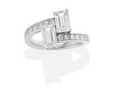 DIAMOND RINGTwo octagonal step-cut diamonds obliquely-set between brilliant-cut diamond shoulders, mounted in platinum, princ