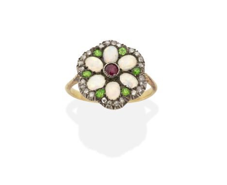 DEMANTOID GARNET, RUBY, OPAL AND DIAMOND RING, LATE 19TH CENTURYDesigned as a flowerhead, set with opal cabochons, a circular