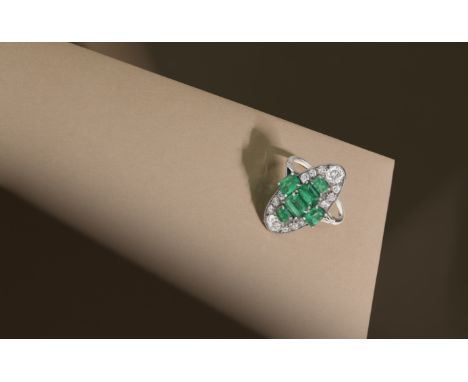 ART DECO EMERALD AND DIAMOND RING, CIRCA 1925Step-cut emeralds, cushion-shaped and single-cut diamonds, emeralds approx. 2.65