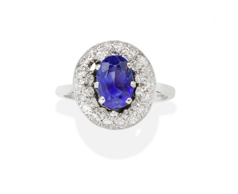 SAPPHIRE AND DIAMOND RINGThe oval-cut sapphire within a brilliant and single-cut diamond surround, sapphire very approx. 2.50