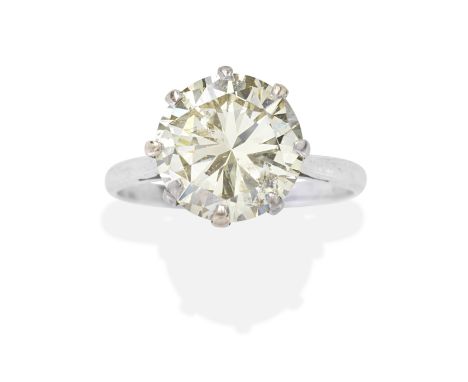 DIAMOND SINGLE-STONE RINGThe brilliant-cut diamond, weighing 4.95 carats, partial UK hallmark, ring size approx. P½For furthe