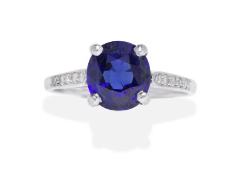 SAPPHIRE AND DIAMOND RINGThe oval-cut sapphire, weighing 1.78 carats, between single-cut diamond set shoulders, ring size app