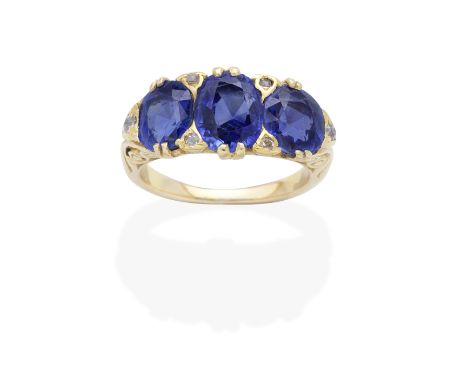 SAPPHIRE AND DIAMOND RING, LATE 19TH CENTURYCushion-shaped sapphires, accented by cushion-shaped and rose-cut diamonds, ring 