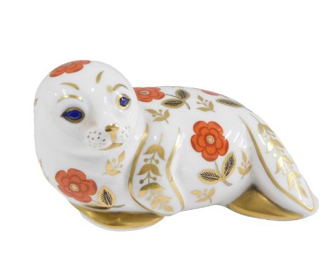 A Royal Crown Derby seal paperweight, unmarked, silver button, 13cm wide. 