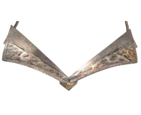 A silver necklace, of layered V shaped form, on a fine link neck chain, with bolt ring clasp. 