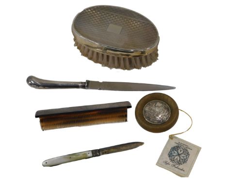 A collection of small silver, to include a silver mounted brush, mother of pearl fruit knife with silver blade, comb with sil