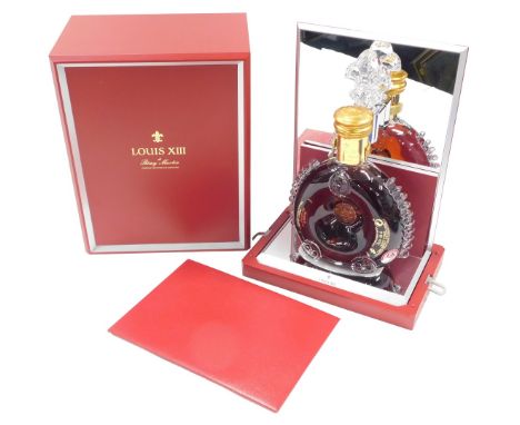A bottle of Remy Martin Louis XII Cognac, in presentation box, with registration number KA-8163.