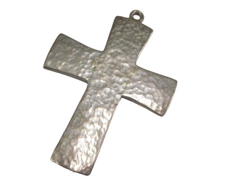 A silver pendant cross, with a textured finish. 