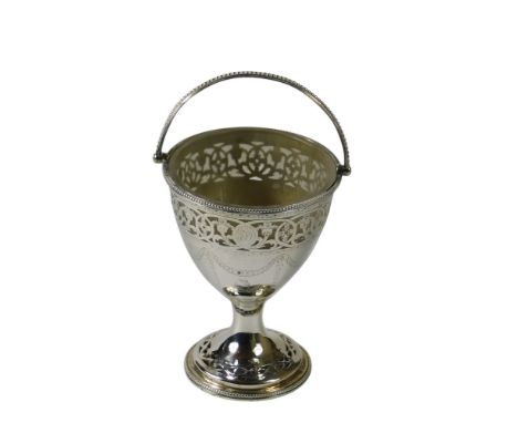 A mid 18thC silver swing-handled sugar basket, with a pierced and floral engraved border, and central thistle crest, by Willi