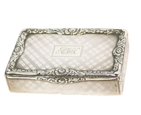 An Edward VII rectangular silver snuff box, with engine turned decoration within a cast border of scrolls and flower heads, m