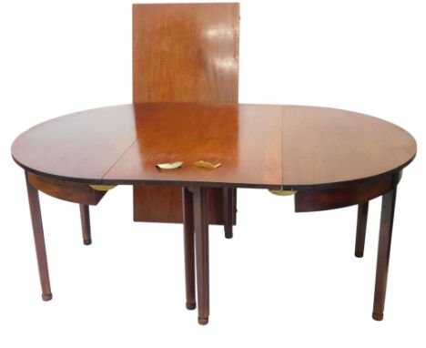 A George III mahogany dining table, with gate leg action, two D-ends supporting, two additional leaves, on tapering legs, 244