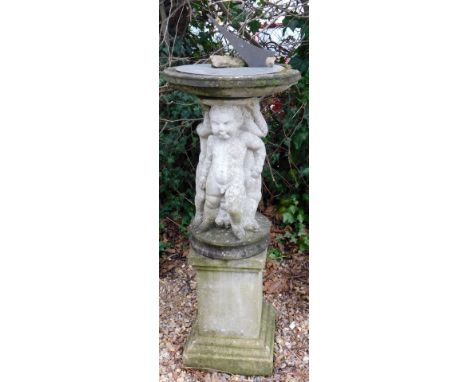 An engraved brass sundial, on a reconstituted base decorated with putti and a plain plinth, 150cm high overall, 52cm diameter
