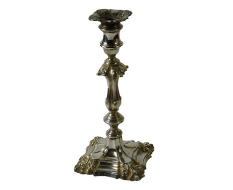 An 18thC style silver candlestick, cast with leaves, on a shaped square base, loaded, Birmingham 1969, 29cm high.