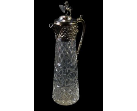 A cut glass and silver plated claret jug, the hinged lid mounted with a Heraldic lion, 32cm high.