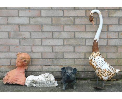 A pig garden ornament, and other ornaments.