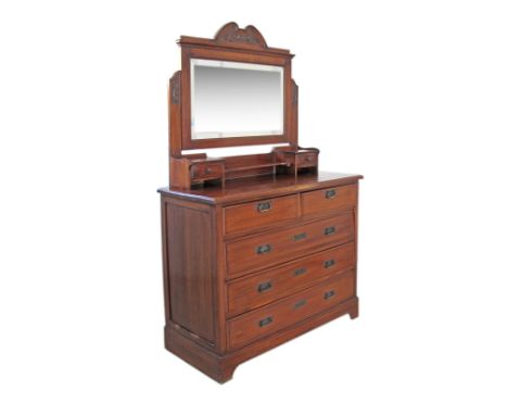 A French style c19th century mahogany commode with dressing table top, three long drawers under two short, a beveled swinging