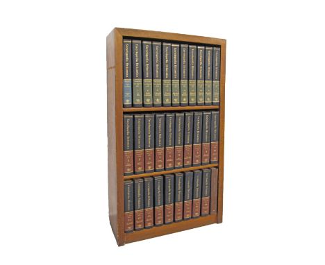 A three shelf bookcase containing 31 volumes of Encyclopaedia Britannica, 15th Edition, leather bound. One vol. Propaedia, 10