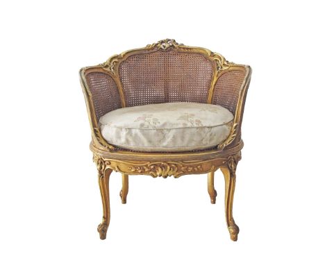 A French Louis XV - Rococo style carved and giltwood marquise en corbeille, oval cane seat and back, with silk upholstered cu