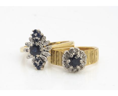 Two 18ct gold sapphire cluster rings, claw set surrounded with eight cut diamonds, both with yellow metal shanks, ring sizes 