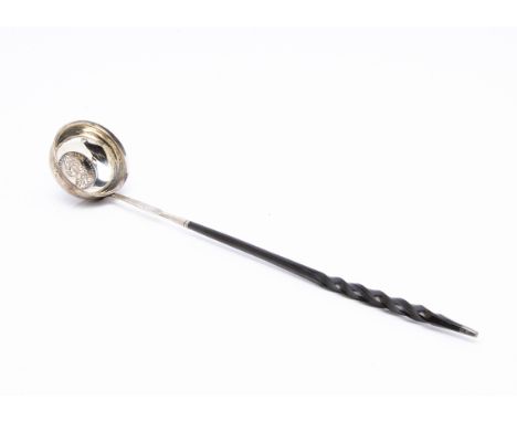 A George III silver toddy ladle, the hallmarked bowl, worn, inset with a George II 1745 half crown, with engraved initials RG