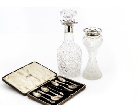 An early George V cut glass and silver mounted decanter and stopper, together with a cut glass and silver mounted vase and a 