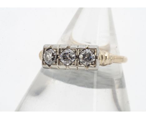 A three stone diamond ring, the old cut diamonds in square illusion settings, on yellow metal shank, ring size O, 2.4g, 0.30c