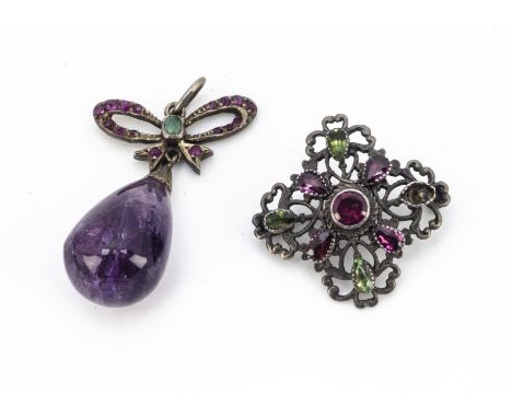 An amethyst, emerald and ruby set pendant, the tear shaped amethyst bead supported on a bow mount and oval bale, 4cm drop, to