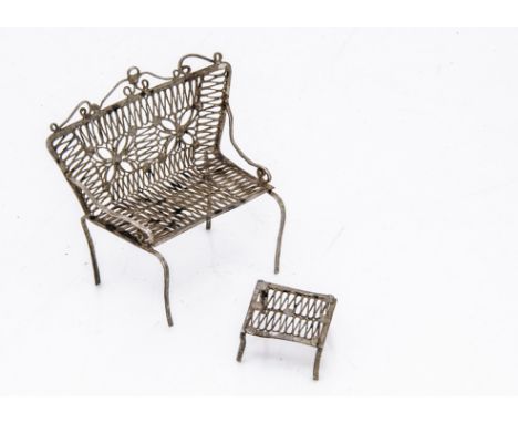A continental white metal filigree miniature sofa and footstool, possibly from a dolls' house and Maltese, 4.2cm wide (2)