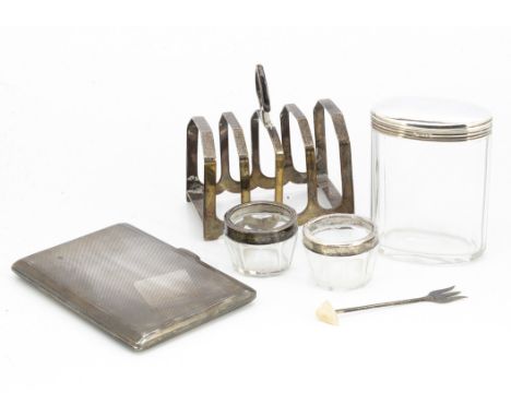 An Art Deco period silver cigarette case, together with a silver toast rack, a pair of glass salts, a small fork and a glass 