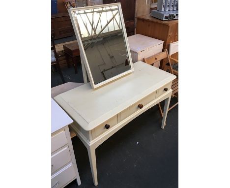 A painted dressing table, the central long drawer flanked by two short, with adjustable mirror, 107cmW