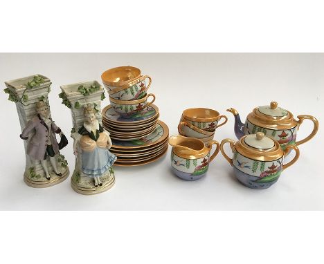 A decorative Japanese tea service together with two continental figurine vases