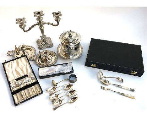 A mixed lot of silver plated items, to include three arm candlestick, two candlesticks with snuffers, hinged and lidded pot, 