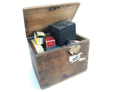 A pine travel box with a mixture of vintage photographic equipment and cine 8 films