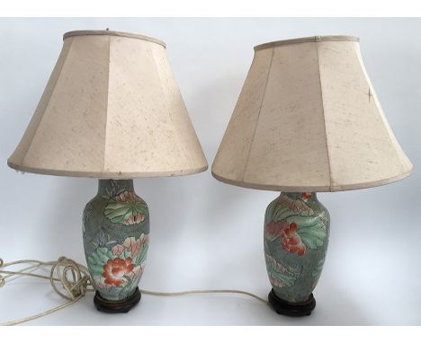 A pair of Oriental ceramic lamps with shades