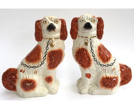 A pair of ceramic Staffordshire dogs